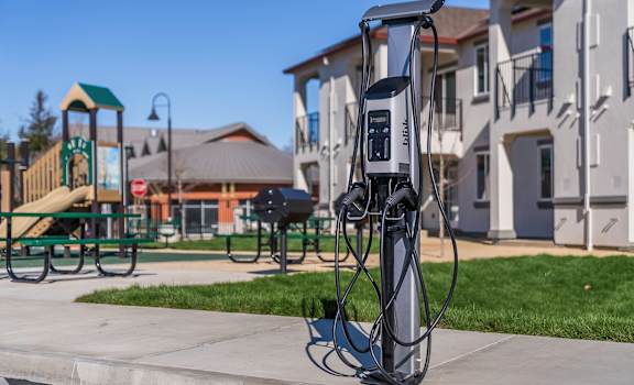 A charging station for electric vehicles is located in a park.