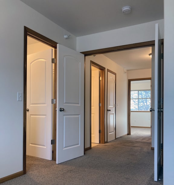 a bedroom with a bed and a ceiling fan