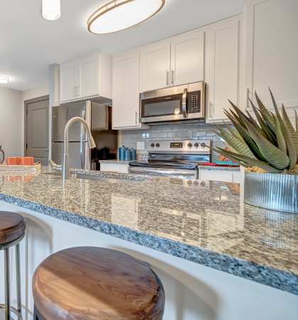 Kitchen with White Shaker Cabinets at Latitude at South Portland Apartment, Maine, 04106