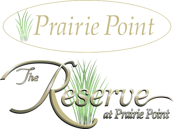 The image shows a logo with the text "Prairie Point" and "The Reserve at Prairie Point" with decorative elements.