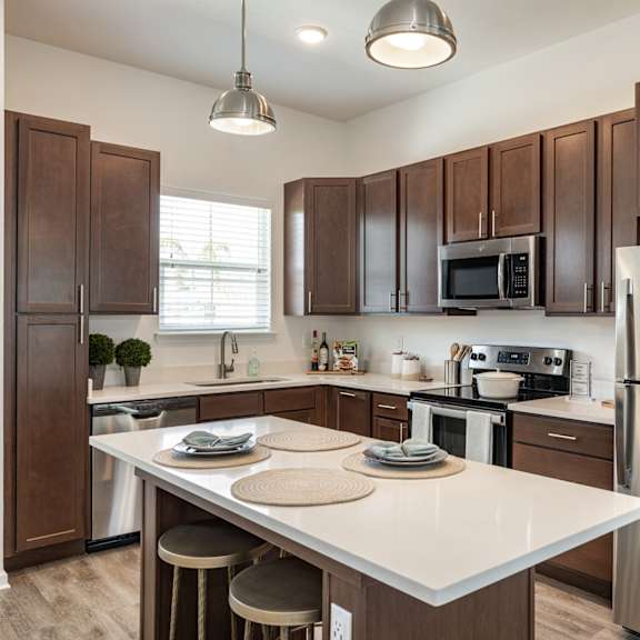 Gourmet kitchen with an island at Estia at Lakewood Ranch, Bradenton, FL