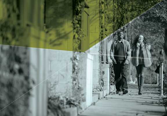 Couple walking down street at 310 @ Nulu Apartments, Louisville, KY