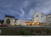 Thumbnail 3 of 5 - a rendering of the exterior of a building at night