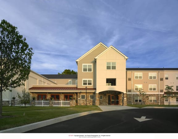 a rendering of the exterior of a building with a sidewalk