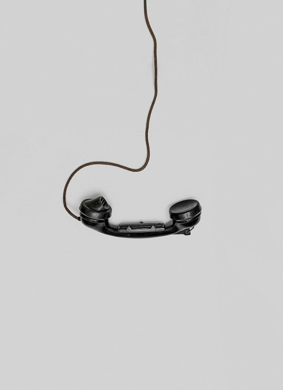 a pair of headphones hanging from a cable