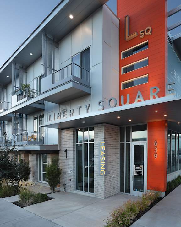 A modern building with the words "Liberty Square" on the front. at Liberty Square Apartments - Saltlake City, UT Apartments, Saltlake City, Utah