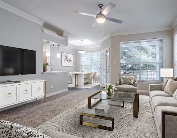 Bright, elegant living space with modern decor and large windows.