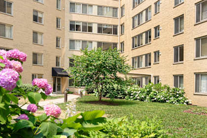 A building with a garden in front of it.