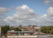 Thumbnail 4 of 6 - the view of the city from the roof of a building