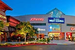 A large shopping center with a variety of stores including a Best Buy and a Macy's.