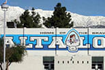 A large white building with a blue sign that says "Malt-A-Loom".