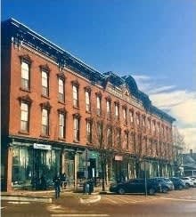 a large brick building on a city street