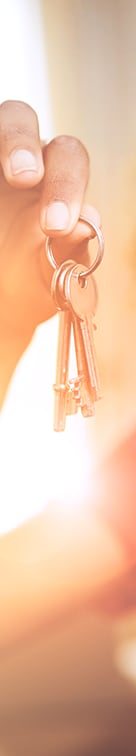 a hand holding a bunch of keys