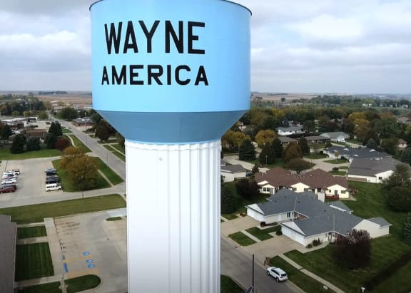 a water tower in a suburb of a city