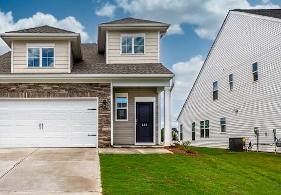 a home with a white garage door