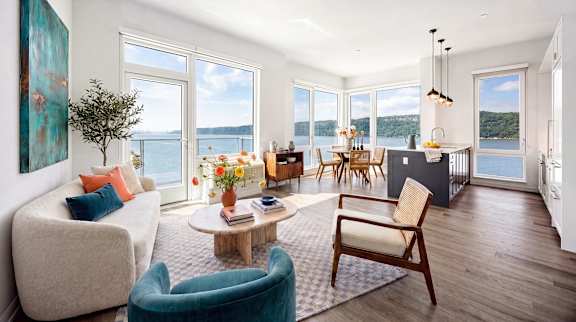 A living room with a view of the lake.