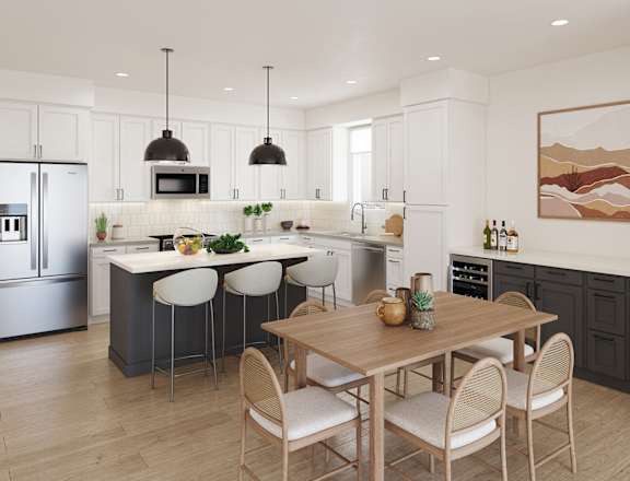a kitchen and dining room with a table and chairs