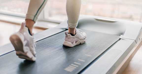 a close up of a woman running on a treadmill at Union at Tryon in Charlotte, NC