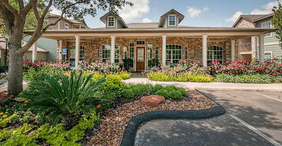 the front of a house with a driveway and a landscaped garden at Sunrise Canyon, Universal City