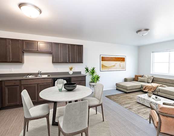 A modern kitchen with a dining table and chairs.