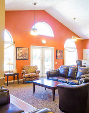 A living room with a couch, chairs, and a coffee table at Northlake Farms Apartments, Gurnee, Illinois