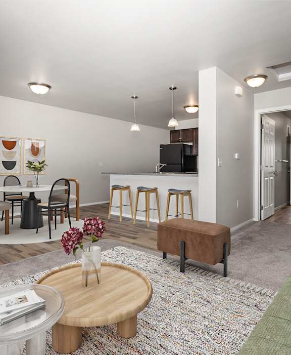 A kitchen with a white countertop and wooden flooring.
