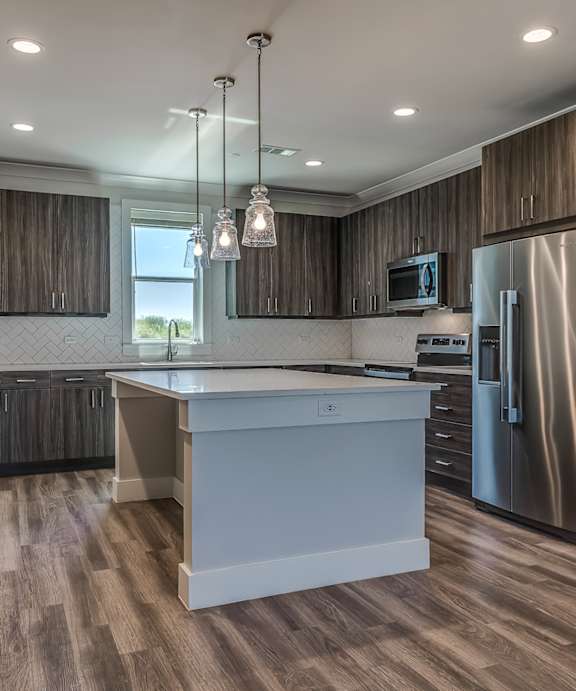 Discovery at the Realm Model Kitchen with Island and Appliances
