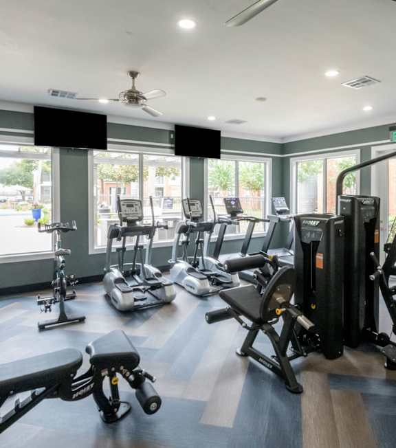 Gym with treadmills and exercise equipment at The Fenwick Apartment Homes, Texas, 77396