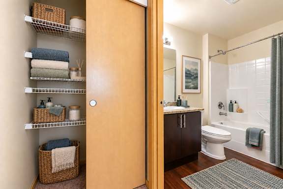 A bathroom with a toilet, sink, and shower.