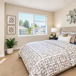 A room with a sliding glass door and a wooden floor.