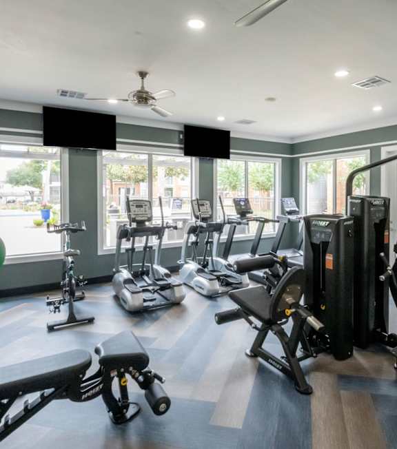 Gym with treadmills and exercise equipment at The Fenwick Apartment Homes, Texas, 77396