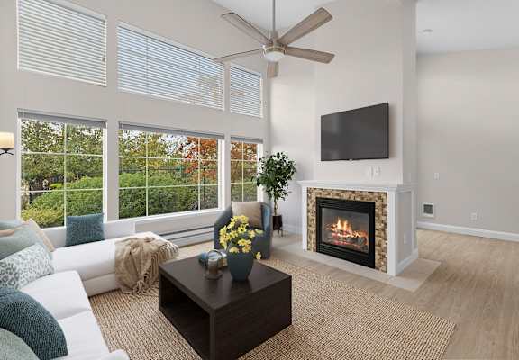 A living room with a fireplace, television, and a coffee table.