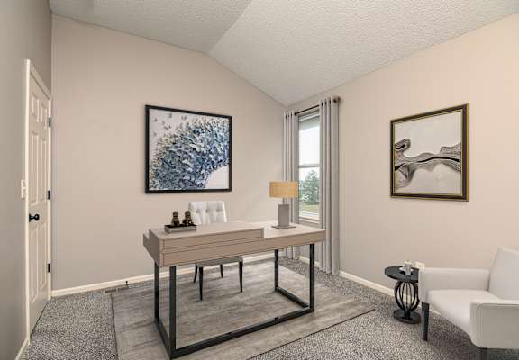 A room with a table, chairs, and two pieces of artwork on the wall.