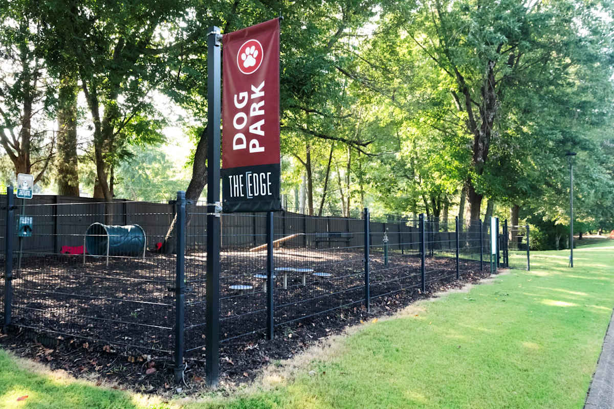 A sign for Dog Park The Edge is shown.