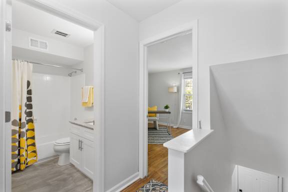Upstairs hallway view at Monon Living showcasing easy access between bedrooms and bathroom in a pet-friendly Broad Ripple apartment near the Monon Trail.