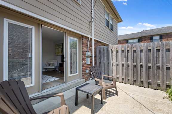 Private outdoor patio at Monon Living in Broad Ripple with fenced-in space, perfect for relaxing just steps from the Monon Trail.