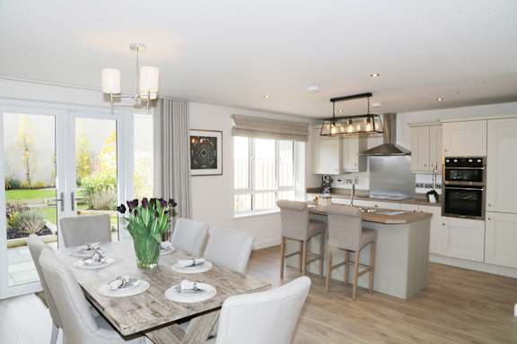 the kitchen and dining area of a house