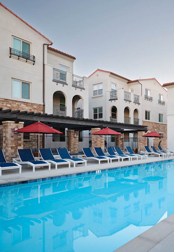 a swimming pool at a hotel with people in it