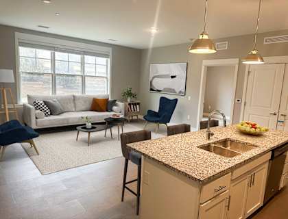 an open floor plan with a kitchen and living room