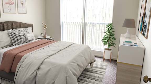 a bedroom with a bed and a large window