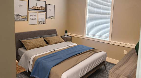 a bedroom with a bed and a chair