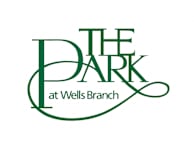 The logo for The Dark at Wells Branch.