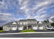 Thumbnail 2 of 3 - a rendering of a large house with cars parked in front of it