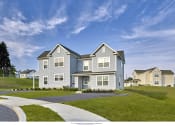 Thumbnail 5 of 6 - a blue house with a sidewalk in front of it