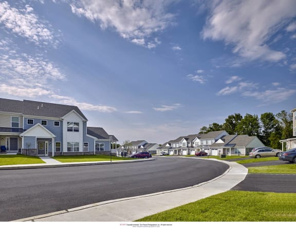 a street with houses on the side of a road