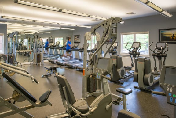 fitness center with machines at Amberleigh apartments in Fairfax VA