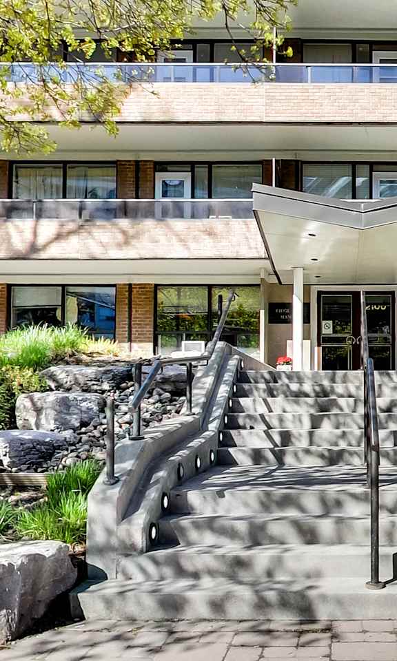 a building with a set of stairs and a fountain