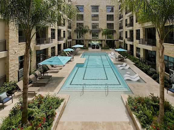 a large swimming pool in the middle of an apartment building