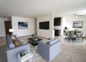 Thumbnail 8 of 8 - a living room and dining room with a couch and a table