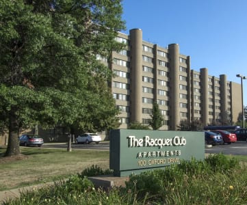 a picture of the regatta apartments sign in front of a parking lot